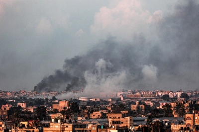 Smoke billows over Khan Yunis in the southern Gaza Strip during Israeli bombardment on Sunday. 