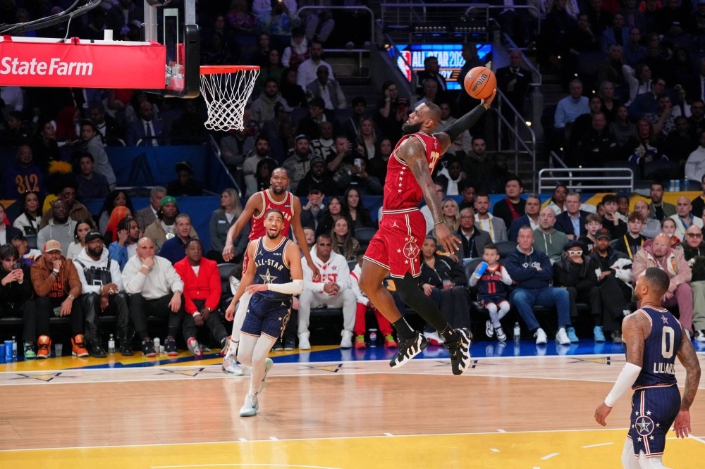 Western Conference forward LeBron James dunks during the first half of the NBA All-Star Game in Indianapolis, Indiana, on Sunday. James said he hopes to finish his career with he Lakers.