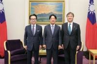 Taiwan President-elect Lai Ching-te (center) poses with Japanese House of Councilors members Tsuneo Kitamura (left) and Iwao Horii in Taipei on Monday. | Taiwan Presidential Office / via Kyodo