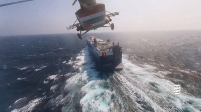 A Houthi military helicopter prepares to land on the Galaxy Leader cargo ship in the Red Sea in November.