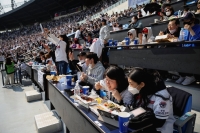 Fans during a game between the Hanwha Eagles and Doosan Bears at Jamsil Baseball Stadium in Seoul in April 2022.  | Reuters