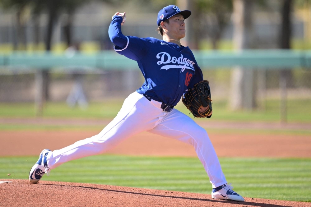 Los Angeles Dodgers starting pitcher Yoshinobu Yamamoto throws live batting practice during spring training in Glendale, Arizona, on Saturday. 
