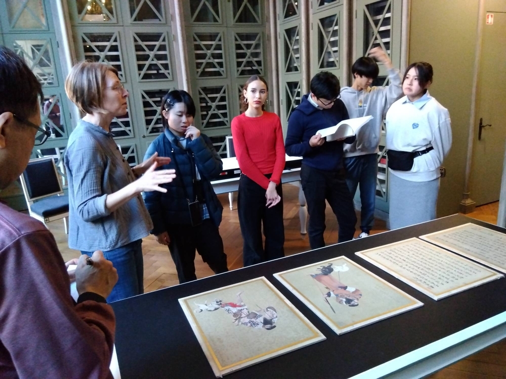Students from Matsumae High School in Hokkaido are shown the paintings on a visit to the museum in Besancon.