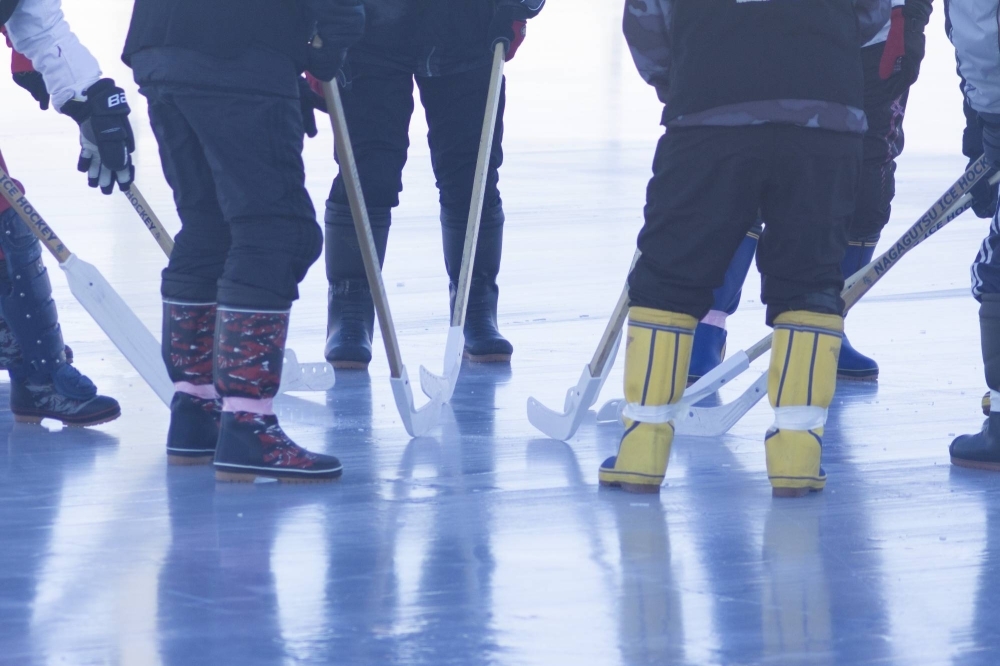 The sport was created in the town of Kushiro in 1978 by former Olympic ice hockey goalkeeper Katsuji Morishima, who married two things every East Hokkaido resident has — a pair of rubber rain boots and a love of ice hockey.