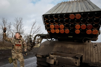 A Ukrainian serviceman with the call sign "Skorpion" prepares to fire a multiple launch rocket system toward Russian troops near a front-line, at an undisclosed location in the Donetsk region, Ukraine, on Feb. 4.
