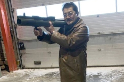 Takeshi Ebisawa poses with a rocket launcher during a meeting with an informant and two undercover Danish police officers at a warehouse in Copenhagen, Denmark on Feb. 3, 2021.