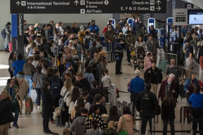 Passengers line up for security at San Francisco International Airport (SFO).