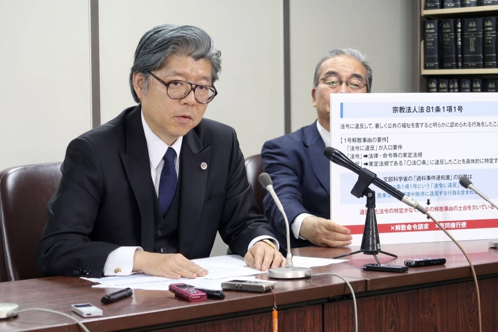 Nobuya Fukumoto, a lawyer for the Unification Church, speaks to reporters in Tokyo on Thursday.