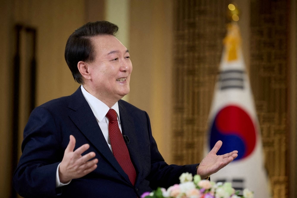South Korean President Yoon Suk-yeol speaks during an interview at the Presidential Office in Seoul on Feb. 4. Yoon has been working to cheer domestic retail investors, who have been heavy sellers of Seoul shares. 