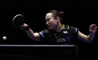 Japan's Mima Ito competes against Romania's Bernadette Szocs during the team event at the table tennis world championships in Busan, South Korea, on Thursday. | REUTERS