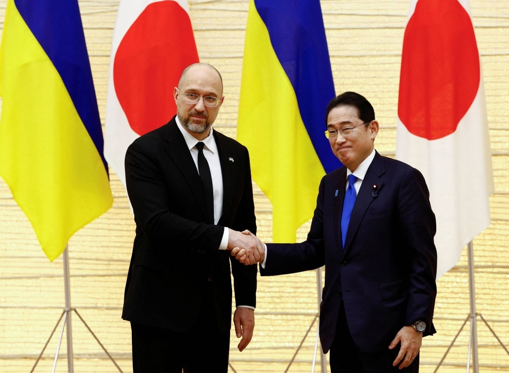 Prime Minister Fumio Kishida meets with Ukraine's prime minister, Denys Shmyhal, during the Japan-Ukraine Conference for Promotion of Economic Growth and Reconstruction in Tokyo on Monday.