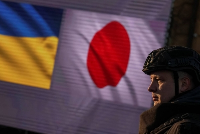 A member of the Ukrainian State Emergency Service attends a transfer ceremony of special vehicles from Japan to Ukraine in Kyiv on Nov. 20, 2023.