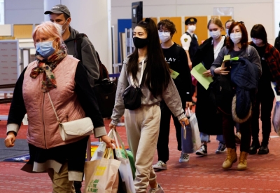 Ukrainian evacuees arrive at Tokyo's Haneda Airport in April 2022.