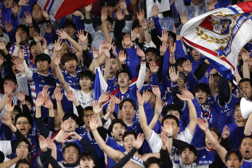 Yokohama F. Marinos fans cheer during the team's Asian Champions League match against Bangkok United on Wednesday. 