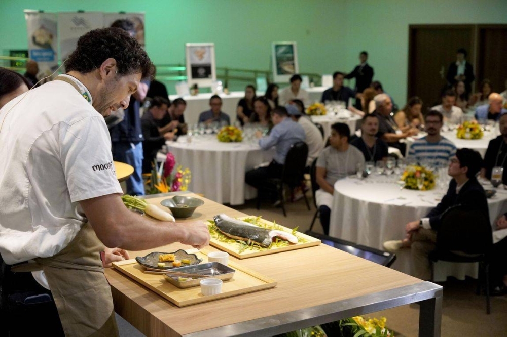 A chef explains Japanese seafood dishes at a promotional event in Sao Paulo in January.