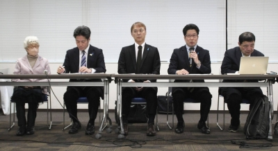 Takuya Yokota (second from right), head of a group of families of abductees to North Korea, speaks at a news conference in Tokyo on Sunday.