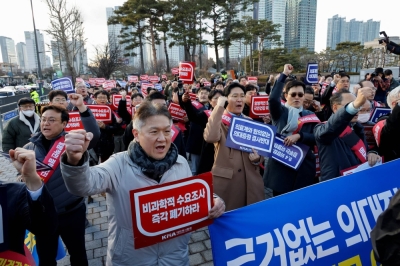 South Korean doctors take part in a protest against the government medical policy in front of the Presidential office in Seoul on Sunday.