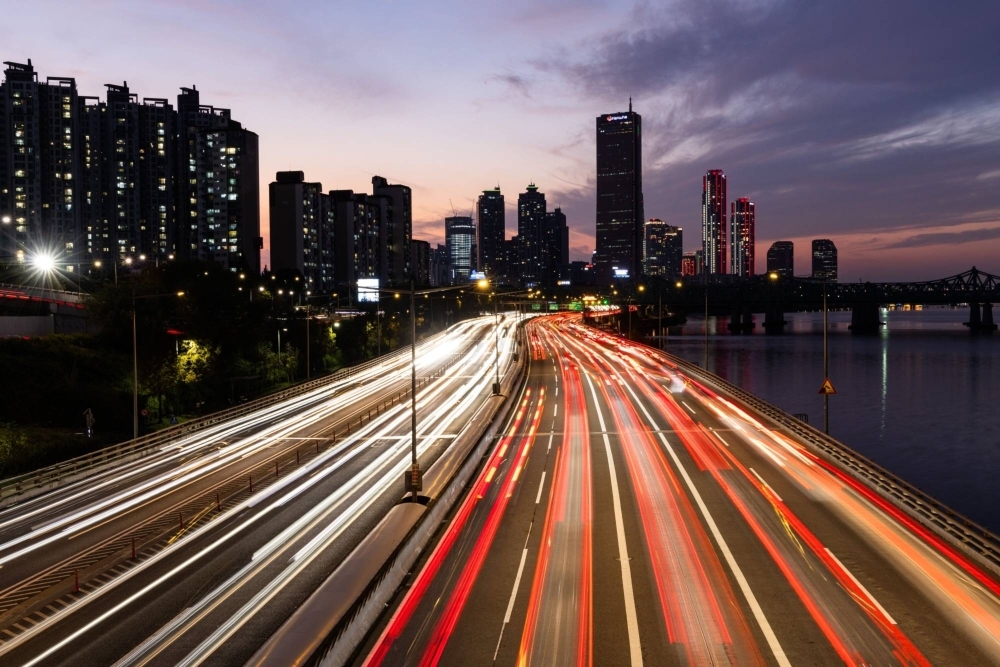 Light trails left by moving traffic in the Yeouido financial district of Seoul