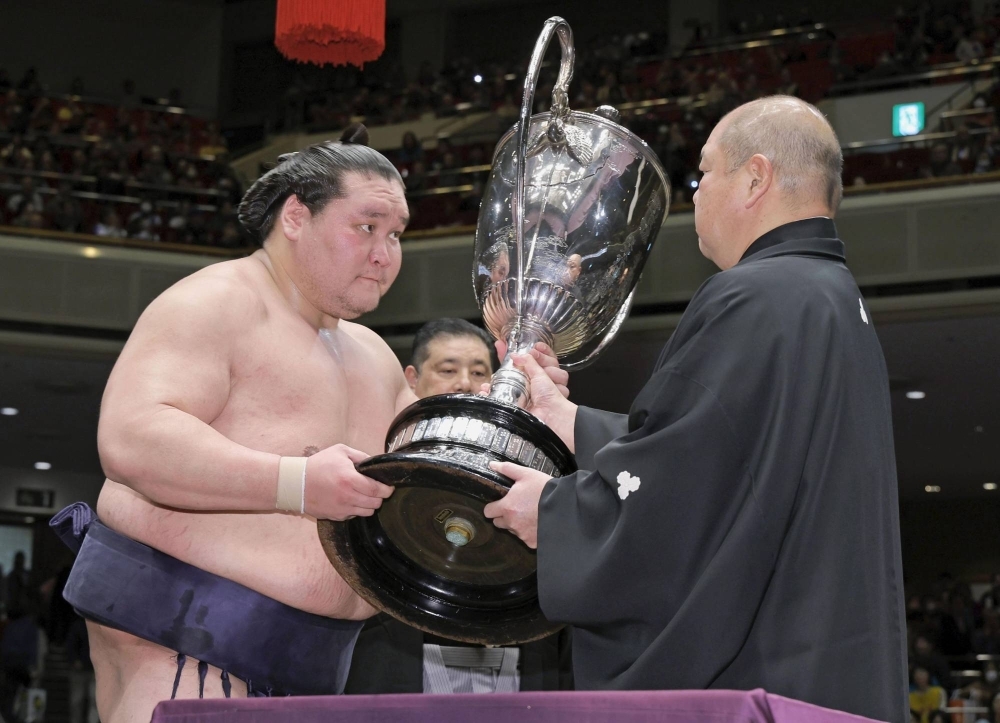 Terunofuji receives the Emperor's Cup after winning the New Year Basho at Ryogoku Kokugikan on Jan. 28.