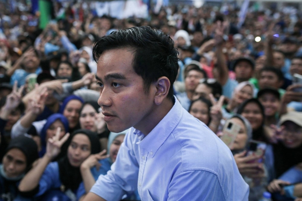Gibran Rakabuming Raka, a son of outgoing President Joko Widodo, attends an election campaign at the Gelora Bandung Lautan Api Stadium in Bandung, West Java, on Feb. 8. By his own admission, Gibran was a "nobody" a few months before Indonesia's elections. Now, he is set to become the country's youngest-ever vice president.