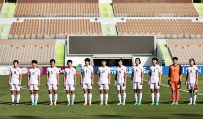 North Korea's national women's soccer team lines up during the national anthems before an Olympic qualifier against Japan on Saturday in Jeddah, Saudi Arabia.