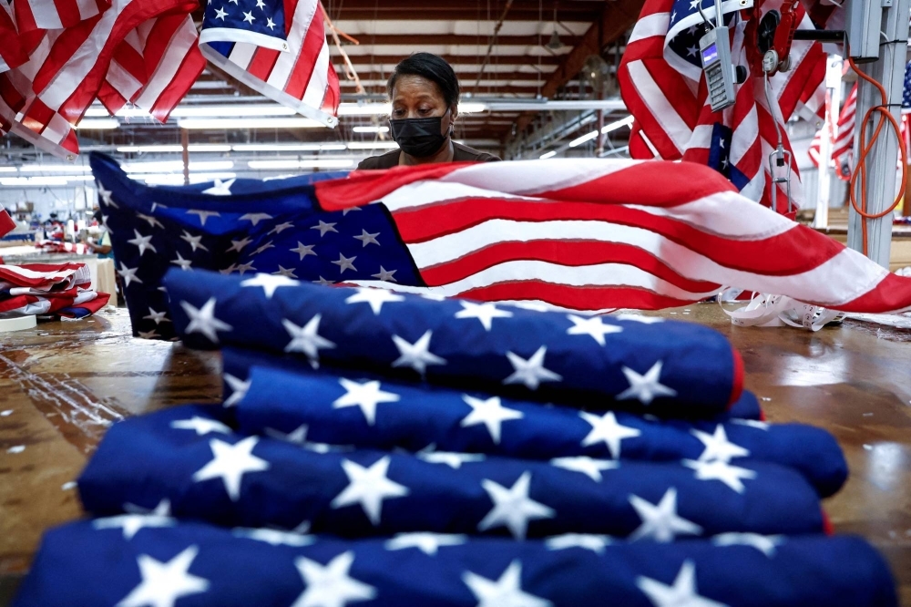 U.S. flags are inspected at Valley Forge Flag’s manufacturing facility in Lane, South Carolina on Feb. 22. Almost a third of independent respondents also picked extremism as their top concern in the poll.