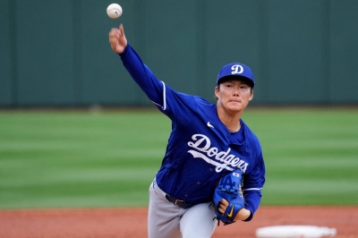 The Dodgers' Yoshinobu Yamamoto pitches against the Rangers during the third inning of their spring training game in Surprise, Arizona, on Wednesday.