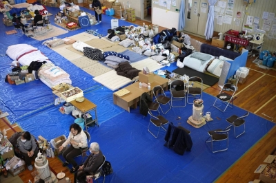 Evacuees inside a gymnasium at a junior high school in Suzu, Ishikawa Prefecture, on Thursday