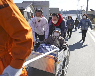 Residents of Otsuchi, Iwate Prefecture, take part in an evacuation drill in March 2021.