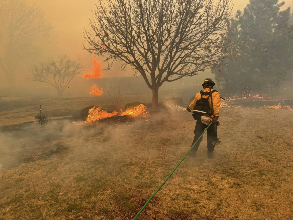 A firefighter battles the Smokehouse Creek Fire, near Amarillo, in the Texas Panhandle on Wednesday.
