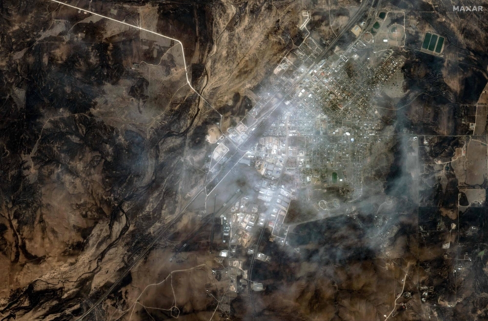 A satellite image of the town of Canadian, Texas, on Wednesday. Seven wildfires were raging in Texas, including one of the largest in recent state history, authorities said Wednesday. 