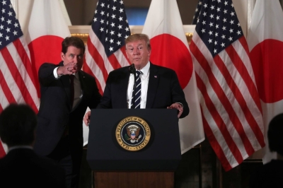 Then-U.S. President Donald Trump attends a Japanese business leaders event with then-U.S. Ambassador to Japan William Hagerty in Tokyo in May 2019. 