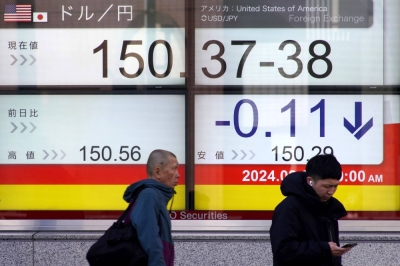 An electronic board shows the rate of the yen versus the U.S. dollar in Tokyo on Feb. 26. 