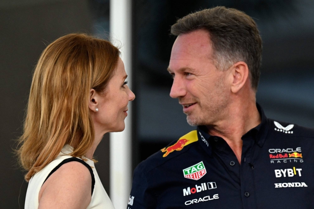 Red Bull team principal Christian Horner speaks with his wife, British singer Geri Halliwell, ahead of the Bahrain Grand Prix on Saturday. 