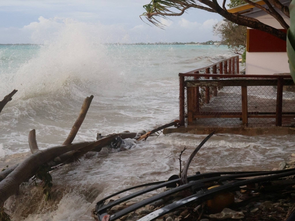 High tides in Funafuti, Tuvalu, in February. About 40% of the main atoll and capital district Funafuti is already underwater at high tide, and the tiny nation is forecast to be submerged by the end of the century.