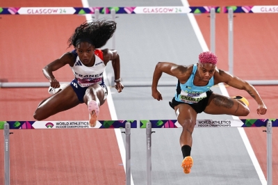France's Cyrena Samba-Mayela (left) and Bahamas' Devynne Charlton compete in the Women's 60-meters hurdles final during the world indoor athletics championships in Glasgow, Scotland, on Sunday.