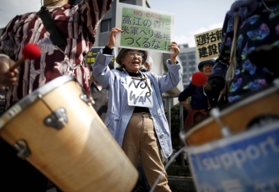 A 2015 protest against the relocation of the U.S. Marine Corps Air Station Futenma to the Henoko area of the city of Nago in Okinawa Prefecture. Many residents are also opposed to an increased military presence and worried about a possible Taiwan contingency.