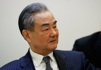 Chinese Foreign Minister Wang Yi attends a meeting at Moncloa Palace in Madrid on Feb. 19. | REUTERS