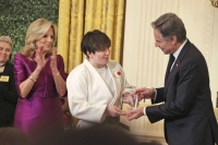 Rina Gonoi (center) receives an award from U.S. Secretary of State Antony Blinken at a ceremony in Washington on Monday, with First Lady Jill Biden standing next to her.  | Kyodo