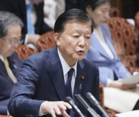Economy minister Yoshitaka Shindo said the government was currently not thinking about calling an end to deflation. | Kyodo