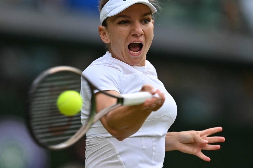 Romania's Simona Halep hits a forehand at Wimbledon in 2022. 