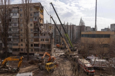 Rescuers clear debris from a multistory building heavily damaged following a Russian drone strike in Odessa on Sunday.