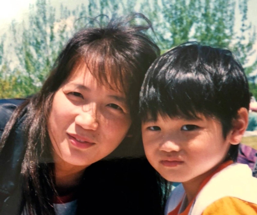 A childhood snapshot of Shohei Ohtani and his mother, Kayoko, posted on MLB’s account on social media website X.