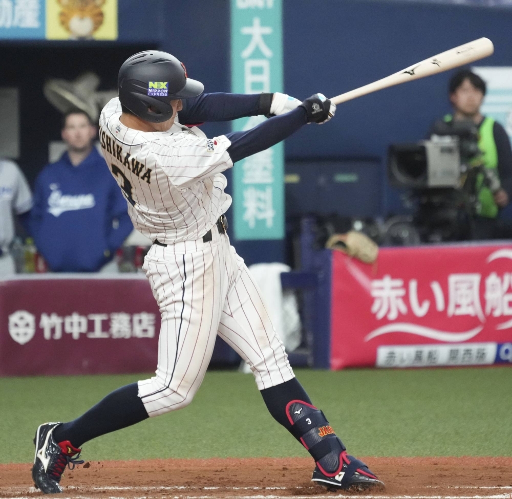 Japan's Misho Nishikawa hits an RBI double against Team Europe in the sixth inning of his team's 5-0 win at Kyocera Dome Osaka on Wednesday.