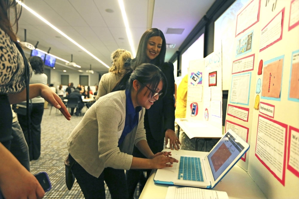 An event for female coders in New York in 2013. Women’s full participation is key to ensure technologies like AI help bridge the gender gap.