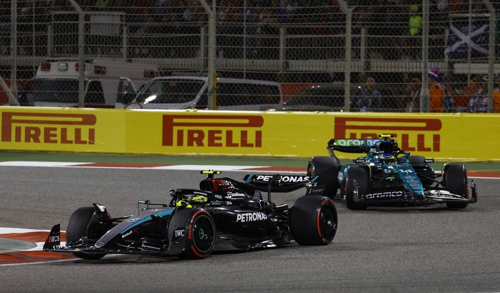 Lewis Hamilton (left) and Fernando Alonso drive during the Bahrain Grand Prix on March 2.