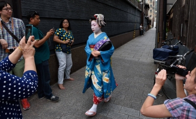 Visitors will be banned from entering private alleys in Kyoto's famous geisha district, Gion, after the district council urged the city to tackle the issue, saying their neighborhood "is not a theme park."