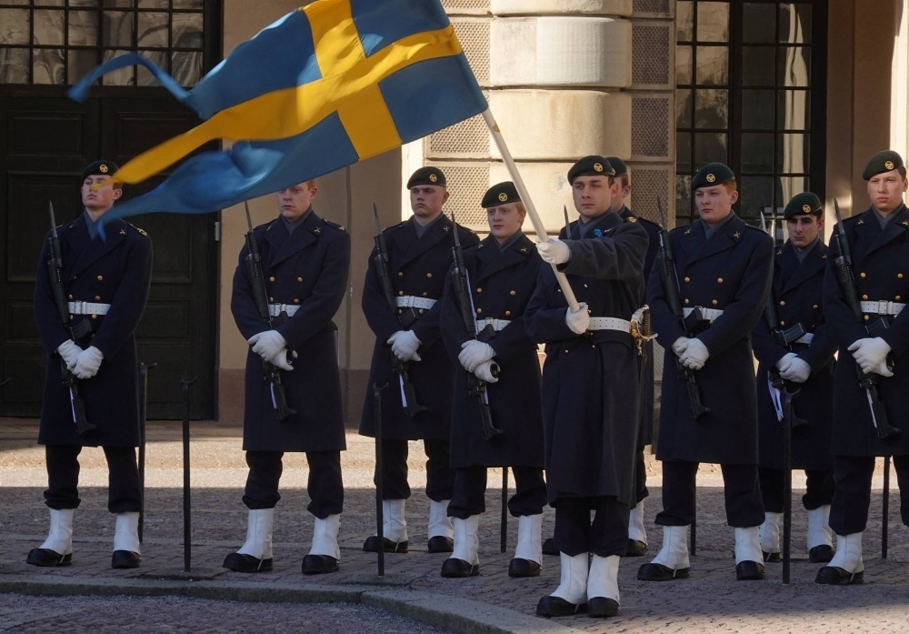 Swedish soldiers take part in the changing of the guard ceremony at the Royal Palace in Stockholm on Thursday.