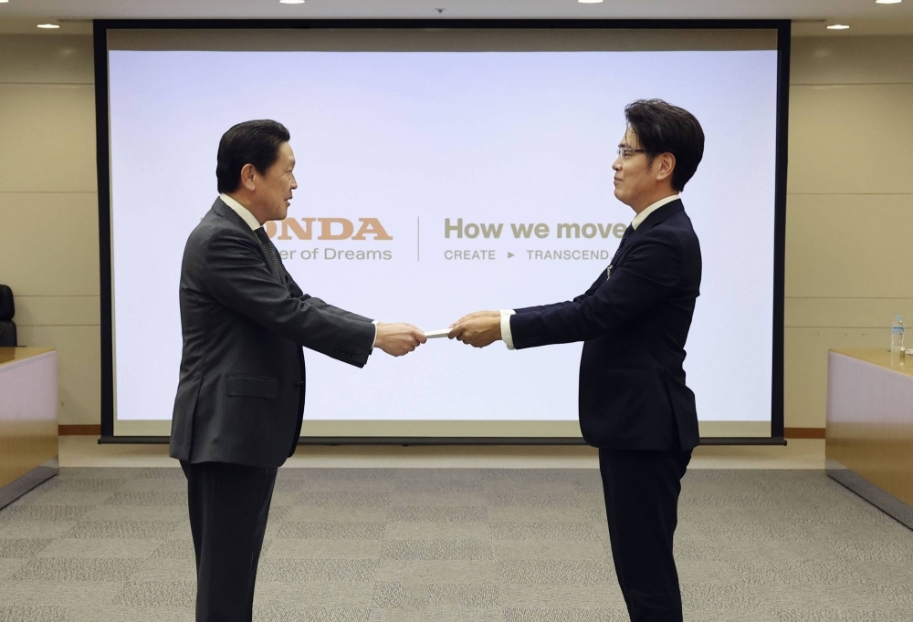 A representative from Honda's labor union submits a demand for spring negotiations to management last month in Tokyo.