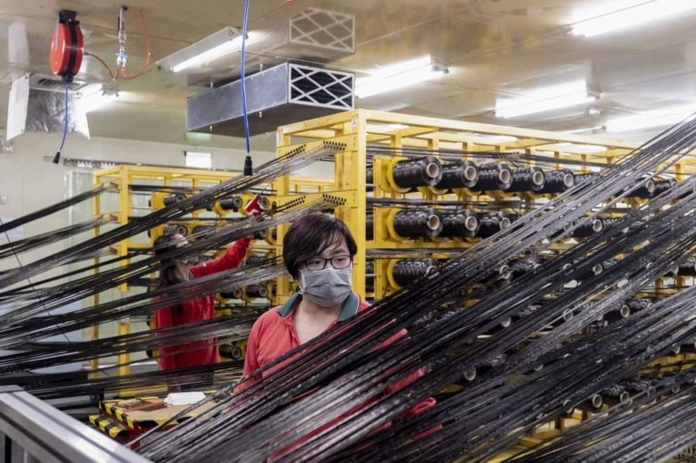 Virgin carbon fiber threads at Swancor’s composite production facility. 